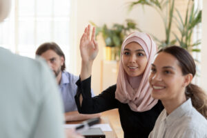 Muslim student raising hand